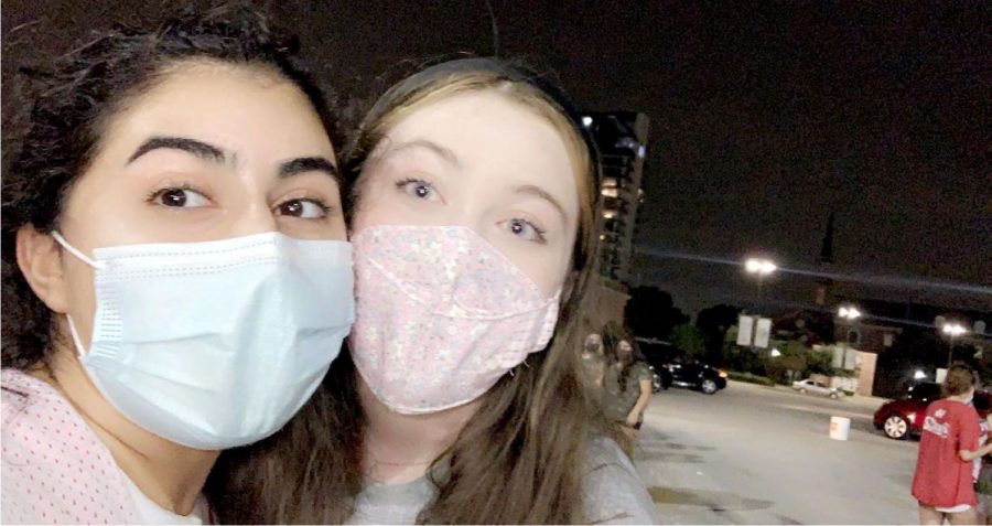 Juniors Sarah Kabouni and Kathryn Stone demonstrate the importance of wearing a mask