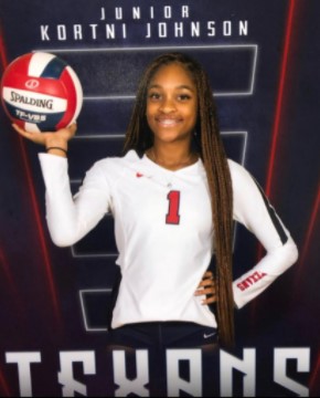 Junior, Kourtni Johnson photographed with a volleyball. 