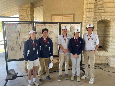 Golf Team with their medals. 