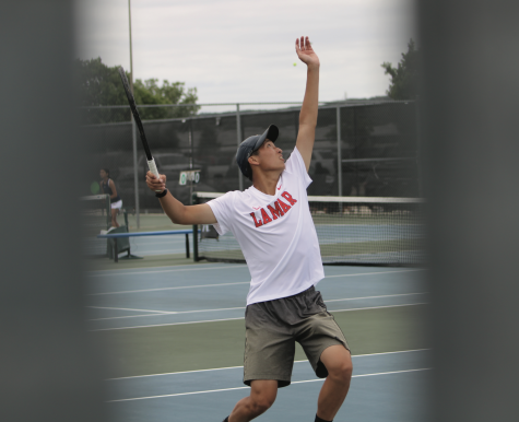 Alex Koong playing tennis