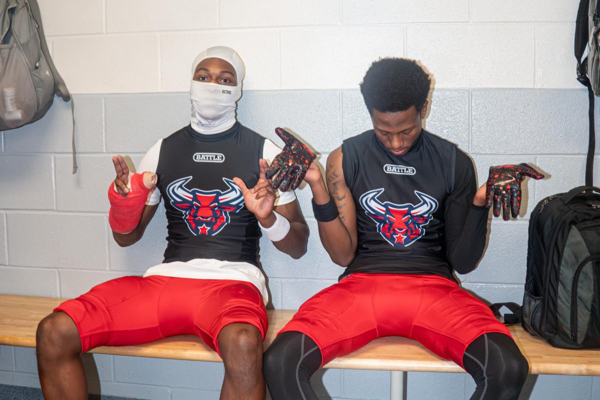 Devin Al-amin and Mason Andy hanging out in the locker room.